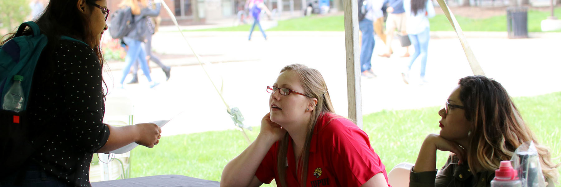 A student discussing a topic with IUPUI staff